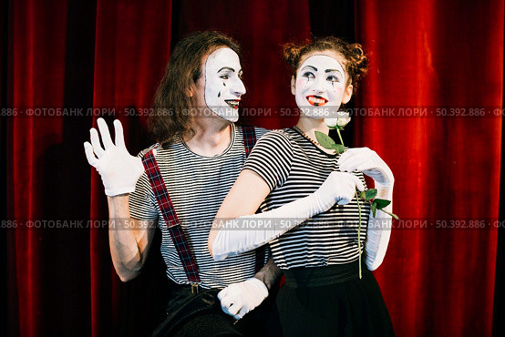 portrait two happy mime artist front red curtain. Стоковое фото, агентство Ingram Publishing / Фотобанк Лори