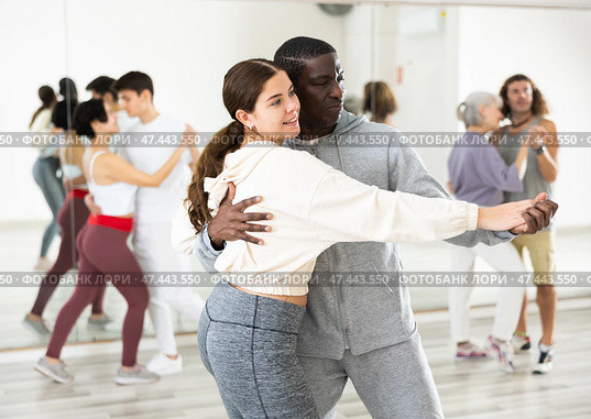 Positive couple of dancers learns a slow foxtrot. Стоковое фото, фотограф Яков Филимонов / Фотобанк Лори