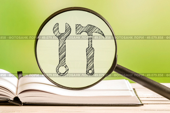 Preferences information with a pencil drawing of tools in a magnifying glass. Стоковое фото, агентство Ingram Publishing / Фотобанк Лори
