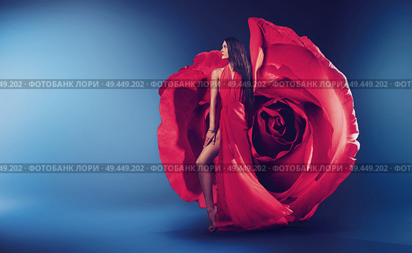 Pretty brunette woman wearinf fabulous red rose dress. Стоковое фото, агентство Ingram Publishing / Фотобанк Лори