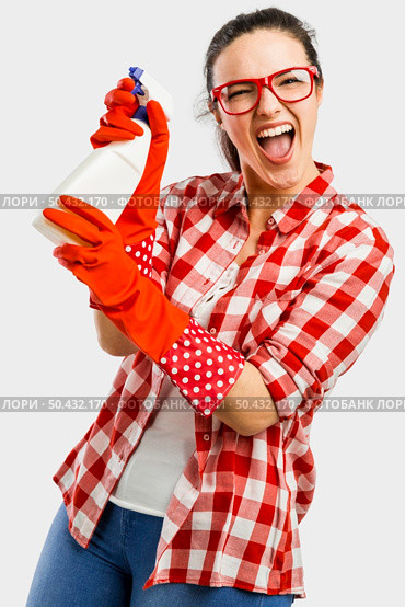 Pretty woman wearing gloves and holding a cleaning spray . Стоковое фото, агентство Ingram Publishing / Фотобанк Лори