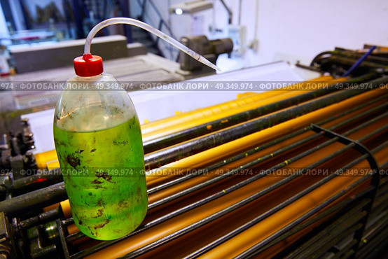 Printer ink machine rotary printing. Printer ink machine rotary printing factory cleaning bottle. Стоковое фото, агентство Ingram Publishing / Фотобанк Лори