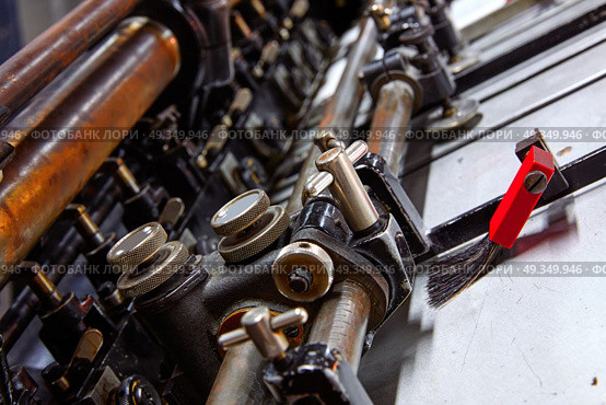 Printer lithography cylinder machine printing. Printer lithography cylinder machine in a printing factory. Стоковое фото, агентство Ingram Publishing / Фотобанк Лори