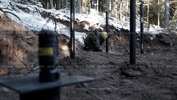 Process of strengthening the soil with piles at the construction site. Стоковое фото, фотограф David Kashakhi / Фотобанк Лори