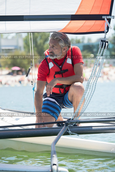 professional waterman training on lake with catamaran. Стоковое фото, агентство Ingram Publishing / Фотобанк Лори