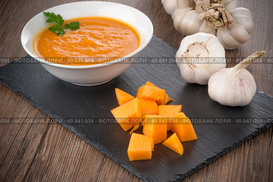 Pumpkin soup on white wood background. Стоковое фото, агентство Ingram Publishing / Фотобанк Лори