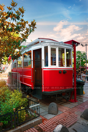 Red old tram on the street of Istanbul. Red old tram. Red old tram. Стоковое фото, агентство Ingram Publishing / Фотобанк Лори