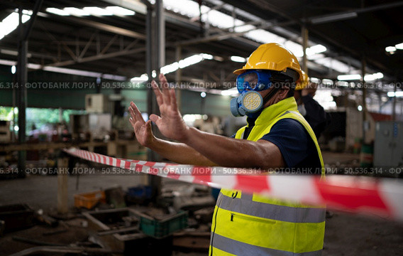 Restricted area, officials employ white and red stripes to block the area where a chemical leak is occurring. To prevent individuals from coming into contact with potentially dangerous chemicals, Стоковое фото, агентство Ingram Publishing / Фотобанк Лори