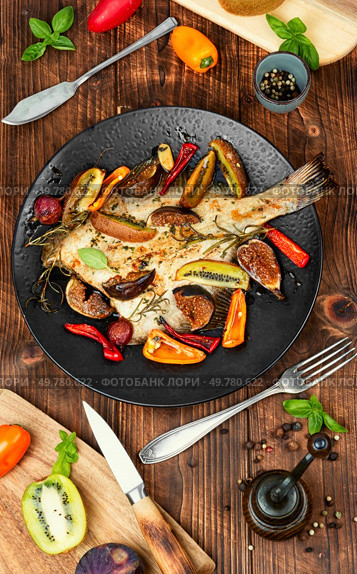 Roasted flounder fish, flatfish on rustic wooden table.. Fried flounder fish. Стоковое фото, агентство Ingram Publishing / Фотобанк Лори