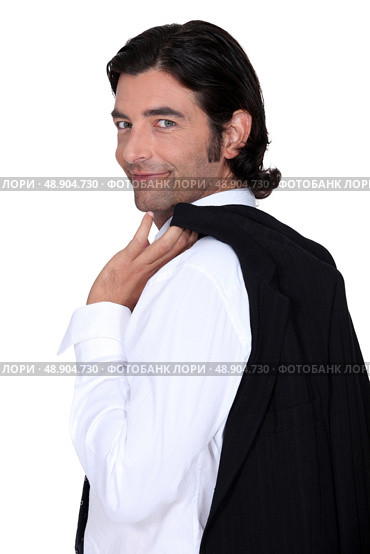 Roguish gent holding his jacket over his shoulder. Стоковое фото, агентство Ingram Publishing / Фотобанк Лори