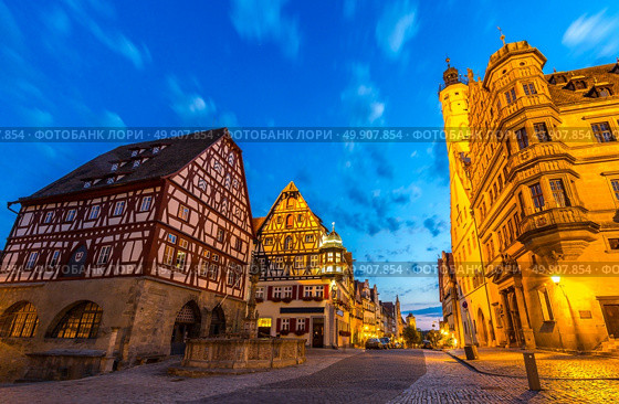 Rothenburg City hall of historic town at Rothenburg ob der Tauber, Franconia, Bavaria, Germany sunset. Стоковое фото, агентство Ingram Publishing / Фотобанк Лори