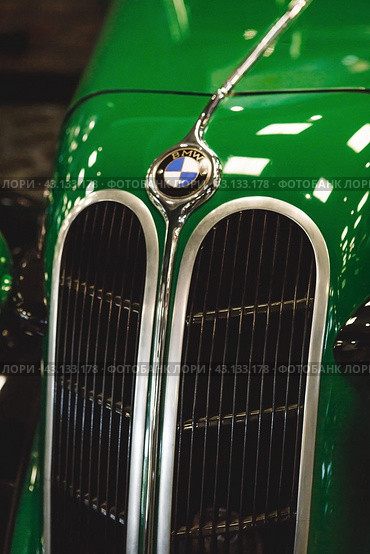 RUSSIA, MOSCOW - May 11, 2024: Close-up of the BMW logo on the hood of a retro car. Редакционное фото, фотограф Photojuli / Фотобанк Лори