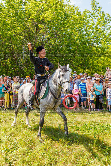 Russia, Samara, June 2016: A dashing Cossack on horseback during a demonstration performance at the Journey to the Past festival. Редакционное фото, фотограф Акиньшин Владимир / Фотобанк Лори