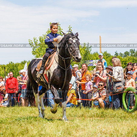 Russia, Samara, June 2016: A dashing Cossack on horseback during a demonstration performance at the Journey to the Past festival. Редакционное фото, фотограф Акиньшин Владимир / Фотобанк Лори