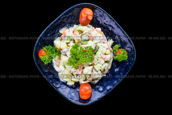 Russian salad olivie on black background top view. Стоковое фото, фотограф Татьяна Терехина / Фотобанк Лори