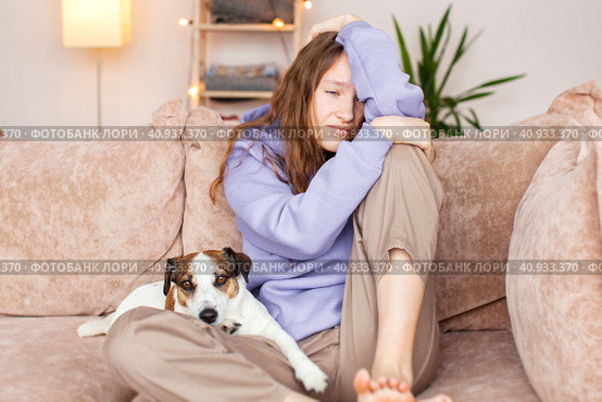 Sad depressed young adult woman crying alone at home, upset. Стоковое фото, фотограф Гладских Татьяна / Фотобанк Лори