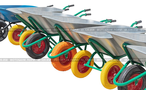 Садовые металлические тележки-тачки, изолированные на белом фоне. Garden metal wheelbarrow cart isolated on white background. Стоковое фото, фотограф Татьяна Д / Фотобанк Лори
