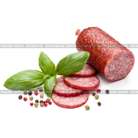 Salami smoked sausage, basil leaves and peppercorns isolated on white background cutout. Стоковое фото, агентство Ingram Publishing / Фотобанк Лори