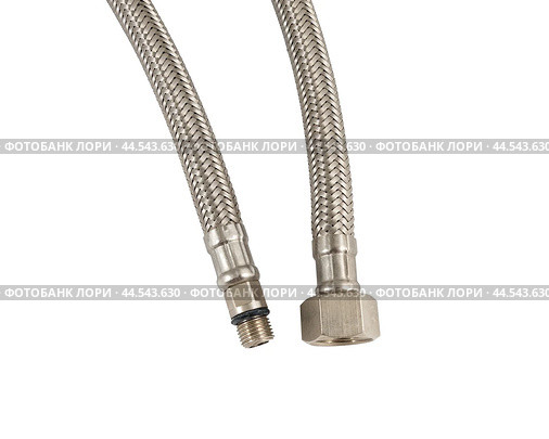 Сантехнический шланг в металлической оплетке для воды на белом фоне. Plumbing hose in a metal braid for water. Стоковое фото, фотограф Татьяна Д / Фотобанк Лори