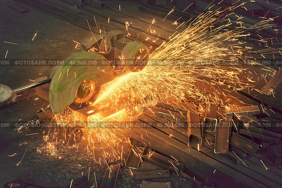 Sawing a metal channel with a saw. Стоковое фото, фотограф Стас Пересыпкин / Фотобанк Лори