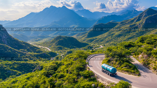 Scenic transport: water tanker descends winding mountain road amidst lush green vegetation. Стоковое AI-изображение, AI-художник Данила Большаков / Фотобанк Лори