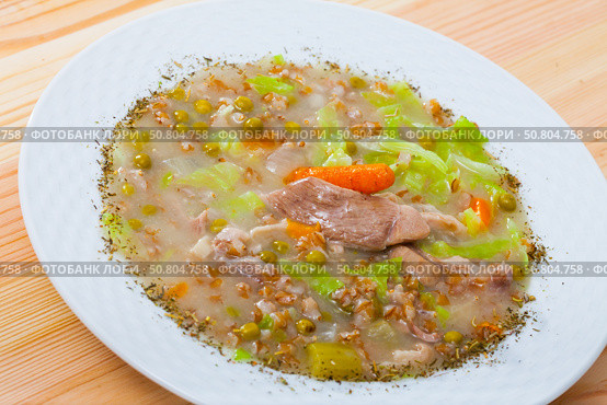 Scotch broth with barley, lamb, vegetables and peas. Стоковое фото, фотограф Яков Филимонов / Фотобанк Лори