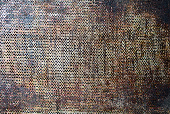 Scratched bottom of an old oven baking tray as a creative background. Copy space.. Background of old oven tray. Стоковое фото, агентство Ingram Publishing / Фотобанк Лори