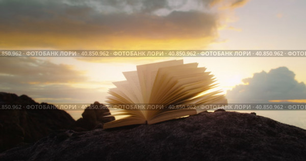 Scriptures on pages of open book at sunset. Rocky lifeless planet. In the begining there was the wor. Стоковое видео, видеограф Ольга Сухарева / Фотобанк Лори