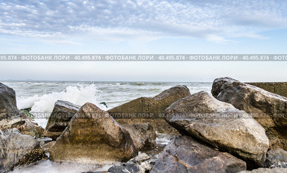Seascape with rocks and surf in the foreground. Стоковое фото, фотограф Артем Курутин / Фотобанк Лори