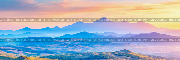Serene Sunset Over Multi-hued Mountain Ranges: A Breathtaking Panorama. Стоковое фото, фотограф Данила Большаков / Фотобанк Лори