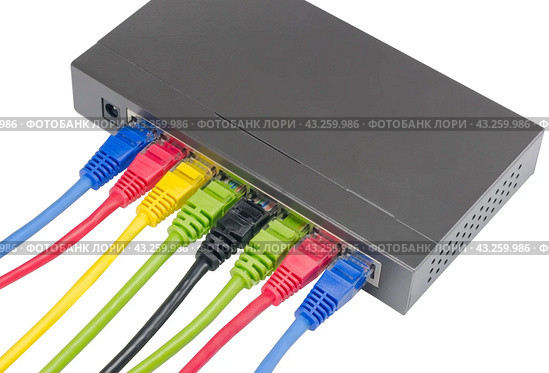 Сетевой коммутатор с подключенными разноцветными сетевыми кабелями. Closeup of network cables connected to router on white. Стоковое фото, фотограф Татьяна Д / Фотобанк Лори