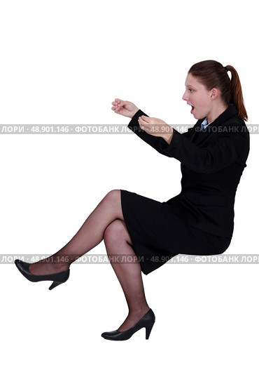 Shocked businesswoman reading an imaginary paper. Стоковое фото, агентство Ingram Publishing / Фотобанк Лори