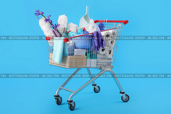Shopping cart full of cleaning supplies and purple flowers on blue background. Стоковое фото, фотограф Pixel_shot / Фотобанк Лори