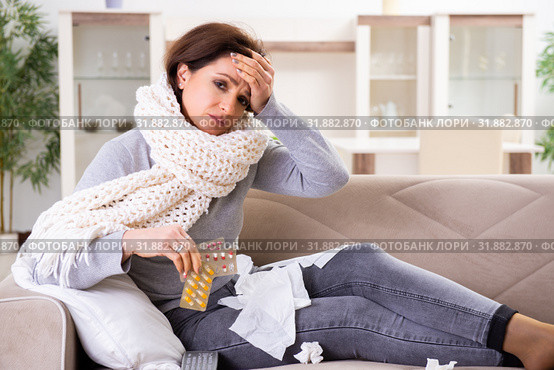 Sick middle-aged woman suffering at home. Стоковое фото, фотограф Elnur / Фотобанк Лори