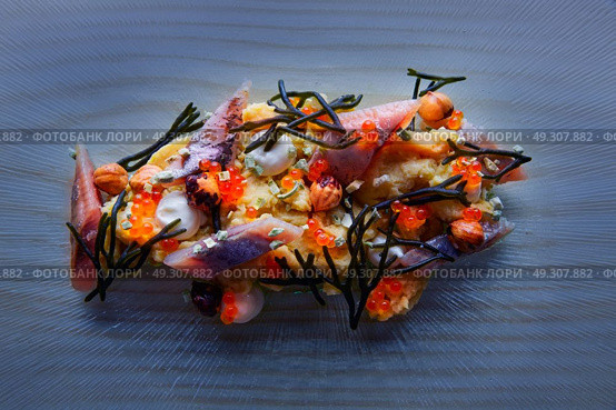 Smoked sardines salad with creamy cheese corn codium and hazelnuts. Стоковое фото, агентство Ingram Publishing / Фотобанк Лори