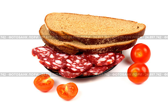 Smoked sausage, cherry tomatoes and bread on a white background. Стоковое фото, фотограф Artem Sobov / Фотобанк Лори