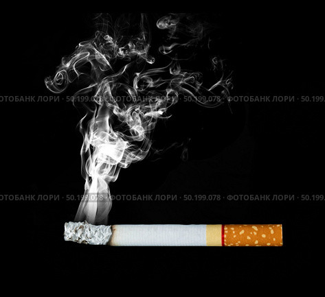 smoking cigarette on black background. Стоковое фото, агентство Ingram Publishing / Фотобанк Лори