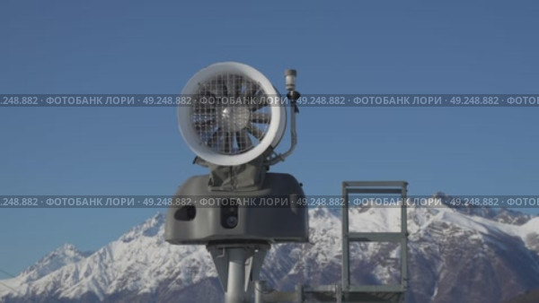 Snow Cannon Maintenance Alps Winter: Technician inspecting snowmaking equipment atop snowy mountains for optimal performance. Стоковое видео, видеограф svetograph / Фотобанк Лори