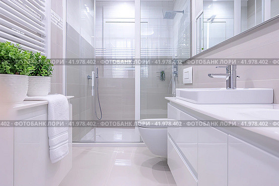 Spacious bathroom in white Design with heated floors, walk-in shower, sink vanity and skylights. Стоковое AI-изображение, AI-художник Ирина Ручушкина / Фотобанк Лори