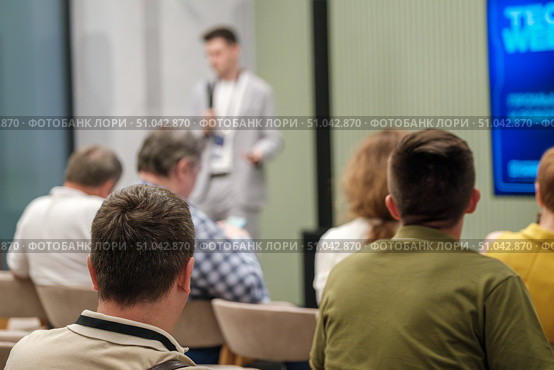 Speaker addressing audience during a professional seminar or conference presentation. Стоковое фото, фотограф Антон Гвоздиков / Фотобанк Лори