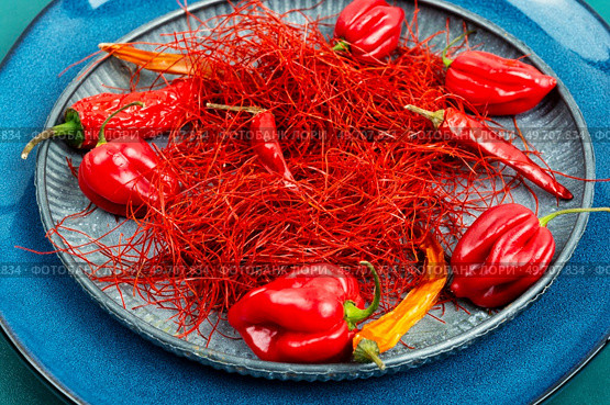 Spicy seasoning, spice, cut from red pepper. Thinly sliced pepper.. Hot red pepper spice. Стоковое фото, агентство Ingram Publishing / Фотобанк Лори