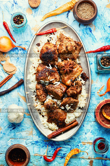 Spicy vindaloo meat with rice. Pork cooked in spicy garlic sauce. Vindaloo, meat in roast spices. Стоковое фото, агентство Ingram Publishing / Фотобанк Лори