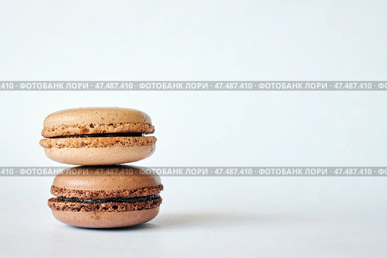 Stack of two brown French Macarons, cakes with coffee and creme brulee flavor. Стоковое фото, фотограф Екатерина Якименко / Фотобанк Лори