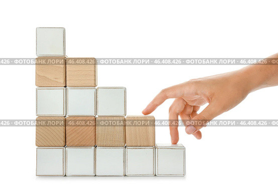 Stacked cubes and female hand imitating walking upstairs against white background. Concept of progress. Стоковое фото, фотограф Pixel_shot / Фотобанк Лори