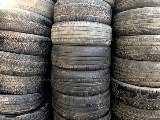 Stacks of old worn-out rubber for cars. Стоковое фото, фотограф Ярославский Максим / Фотобанк Лори