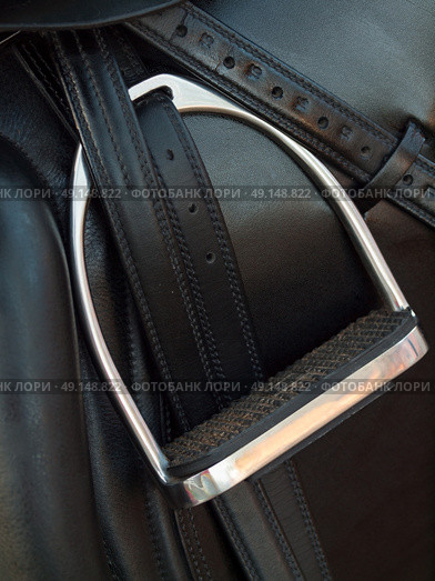 stirrup at dressage saddle. close up. Стоковое фото, агентство Ingram Publishing / Фотобанк Лори
