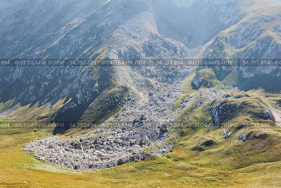 Stone scree - the consequences of a landslide in the mountains. Стоковое фото, фотограф Евгений Харитонов / Фотобанк Лори