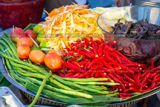 Street food in Asia. Ingredients for preparing Som Tam salad. Sliced vegetables and spices on a plate. Стоковое фото, фотограф Коханова Наталья / Фотобанк Лори