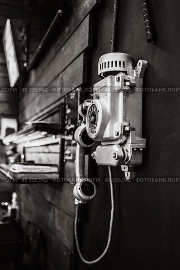 street old phone with a rotary dialer on your office wall. Стоковое фото, агентство Ingram Publishing / Фотобанк Лори