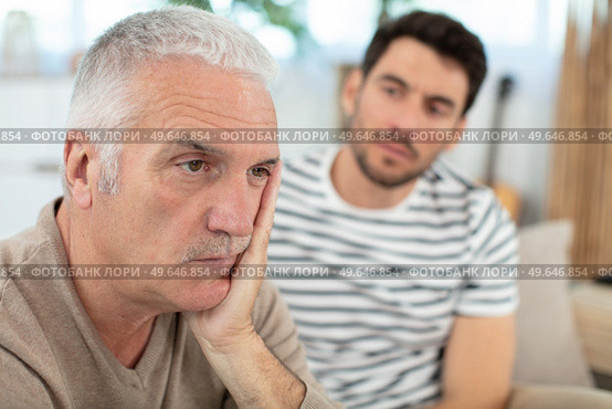 stressed angry senior man trying to talk to dad. Стоковое фото, агентство Ingram Publishing / Фотобанк Лори